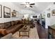 Bright open-concept layout featuring the living room, dining area, and a modern kitchen with wooden floors at 3031 N Civic Center Plz # 340, Scottsdale, AZ 85251