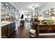 Open concept living room featuring wet bar, fireplace, and access to outdoor balcony at 3031 N Civic Center Plz # 340, Scottsdale, AZ 85251
