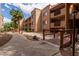 Picturesque walkway with wooden bridges and desert landscaping leading to residential buildings in a quiet community at 3031 N Civic Center Plz # 340, Scottsdale, AZ 85251