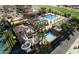 Aerial view of a resort-style community pool and amenity area with water slides at 3080 E Palmdale Ln, Gilbert, AZ 85298