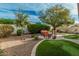 Private backyard featuring lush landscaping, patio seating, and a hammock at 3080 E Palmdale Ln, Gilbert, AZ 85298