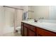 Bathroom features a vanity with a sink, a toilet, and a shower-tub combination at 3080 E Palmdale Ln, Gilbert, AZ 85298