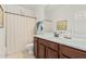 Well-lit bathroom with a shower, sink, toilet, and decorative towel at 3080 E Palmdale Ln, Gilbert, AZ 85298