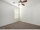 Bedroom features a ceiling fan, plush carpet, and a window for natural light at 3080 E Palmdale Ln, Gilbert, AZ 85298