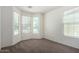 Bright bedroom features plush carpet, large windows, and neutral decor at 3080 E Palmdale Ln, Gilbert, AZ 85298