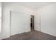 Bedroom features plush carpet, closet, and door leading to a shared bathroom at 3080 E Palmdale Ln, Gilbert, AZ 85298