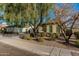 Attractive single-story home featuring rock landscaping and a charming desert front yard at 3080 E Palmdale Ln, Gilbert, AZ 85298