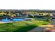 Lush golf course with manicured green, pristine water features, and distant clubhouse at 3080 E Palmdale Ln, Gilbert, AZ 85298