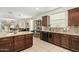 A modern kitchen features granite countertops, stainless steel sink and ample cabinet space at 3080 E Palmdale Ln, Gilbert, AZ 85298