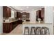 Spacious kitchen features breakfast bar, stainless appliances, granite counters and ample cabinet space at 3080 E Palmdale Ln, Gilbert, AZ 85298