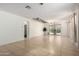 Spacious living room with neutral walls and backyard view at 3080 E Palmdale Ln, Gilbert, AZ 85298