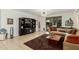 Bright living room showcasing a modern chandelier, neutral sofa, and access to the backyard at 3080 E Palmdale Ln, Gilbert, AZ 85298