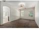 Spacious main bedroom with plush carpeting, two windows, and an ensuite bathroom at 3080 E Palmdale Ln, Gilbert, AZ 85298