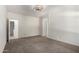 Large main bedroom features neutral decor, ceiling fan, and doorway to an ensuite bathroom at 3080 E Palmdale Ln, Gilbert, AZ 85298