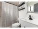 The bathroom includes a vanity sink, toilet, shower, and decorative shelving for an added touch at 3144 S Rogers --, Mesa, AZ 85202