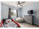This spacious bedroom has a ceiling fan and a large window to provide natural light at 3144 S Rogers --, Mesa, AZ 85202