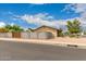 This exterior front yard features a well-maintained lawn, landscaping and a block fence around the property at 3144 S Rogers --, Mesa, AZ 85202