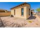 Charming backyard features a stucco building, tile roof, and beautiful xeriscaping at 3171 S Hawthorn Ct, Gold Canyon, AZ 85118