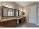 Luxurious bathroom with double vanities, granite counters, and tile flooring at 3171 S Hawthorn Ct, Gold Canyon, AZ 85118