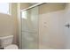 Bathroom with glass-enclosed shower, toilet, and small window at 3171 S Hawthorn Ct, Gold Canyon, AZ 85118