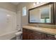 Bright bathroom featuring tub-shower combo and granite countertop vanity at 3171 S Hawthorn Ct, Gold Canyon, AZ 85118