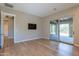 Bedroom with hardwood floors, access to the balcony, and ensuite bathroom at 3171 S Hawthorn Ct, Gold Canyon, AZ 85118