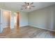 Generously sized bedroom features wood flooring, neutral walls, and an open en-suite layout at 3171 S Hawthorn Ct, Gold Canyon, AZ 85118
