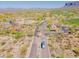 Aerial view of gated community entrance, golf course and desert landscaping on a sunny day at 3171 S Hawthorn Ct, Gold Canyon, AZ 85118