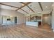 Spacious open-concept living area with a hardwood floors, beam ceilings, and lots of light at 3171 S Hawthorn Ct, Gold Canyon, AZ 85118
