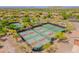 Aerial view of community pickleball courts and tennis courts with golf course in background on a sunny day at 3171 S Hawthorn Ct, Gold Canyon, AZ 85118