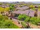 Desert landscaped backyard showcasing a covered patio with mountain views at 3171 S Hawthorn Ct, Gold Canyon, AZ 85118