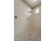 Bright white shower with hexagon tile flooring and a window at 3171 S Hawthorn Ct, Gold Canyon, AZ 85118