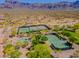 Aerial of neighborhood recreational facilities including tennis courts and basketball court at 3171 S Hawthorn Ct, Gold Canyon, AZ 85118