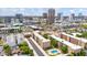 Aerial view of a residential neighborhood with downtown buildings and a pool at 349 E Thomas Rd # E401, Phoenix, AZ 85012