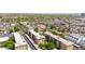 Nice aerial view of an apartment complex featuring beautiful desert landscaping, tree lined streets, and ample parking at 349 E Thomas Rd # E401, Phoenix, AZ 85012