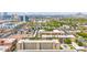 Beautiful aerial view of an apartment complex, showcasing desert landscaping, mature trees and a community pool at 349 E Thomas Rd # E401, Phoenix, AZ 85012