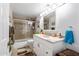 Cozy bathroom with shower over tub, vanity, and decorative accents at 349 E Thomas Rd # E401, Phoenix, AZ 85012