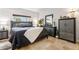 Comfortable bedroom featuring a black bed frame and tiled flooring at 349 E Thomas Rd # E401, Phoenix, AZ 85012