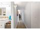 Bright hallway with travertine tile floors, leading to the bathroom and bedroom at 349 E Thomas Rd # E401, Phoenix, AZ 85012