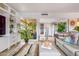 Inviting living room featuring tiled floors, lots of bright light, and built-in shelving at 349 E Thomas Rd # E401, Phoenix, AZ 85012