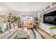 Cozy living room with palm tree views, tiled floors, and stylish decor at 349 E Thomas Rd # E401, Phoenix, AZ 85012