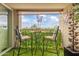 Inviting patio seating area with a decorative sun ornament and beautiful sky views at 349 E Thomas Rd # E401, Phoenix, AZ 85012