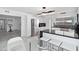 Bright, renovated kitchen features stainless steel appliances, modern lighting, and sleek black countertops at 3758 E Sunnyside Dr, Phoenix, AZ 85028
