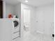 Bright laundry room with washer, dryer, and ample space for cleaning supplies at 3758 E Sunnyside Dr, Phoenix, AZ 85028