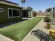 Large backyard featuring a lawn, patio area, and mature landscaping at 4008 W Citrus Way, Phoenix, AZ 85019