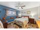 Charming bedroom with a window seat, ceiling fan, and wood-look flooring at 4008 W Citrus Way, Phoenix, AZ 85019