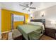 Cozy bedroom with natural light, a ceiling fan, and hardwood flooring at 4008 W Citrus Way, Phoenix, AZ 85019
