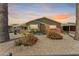Charming single-story home featuring desert landscaping and a brick facade at 4008 W Citrus Way, Phoenix, AZ 85019