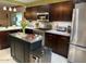 Modern kitchen with stainless steel appliances and dark wood cabinets at 4008 W Citrus Way, Phoenix, AZ 85019