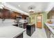 Modern kitchen featuring stainless steel appliances, granite countertops, and a center island at 4008 W Citrus Way, Phoenix, AZ 85019